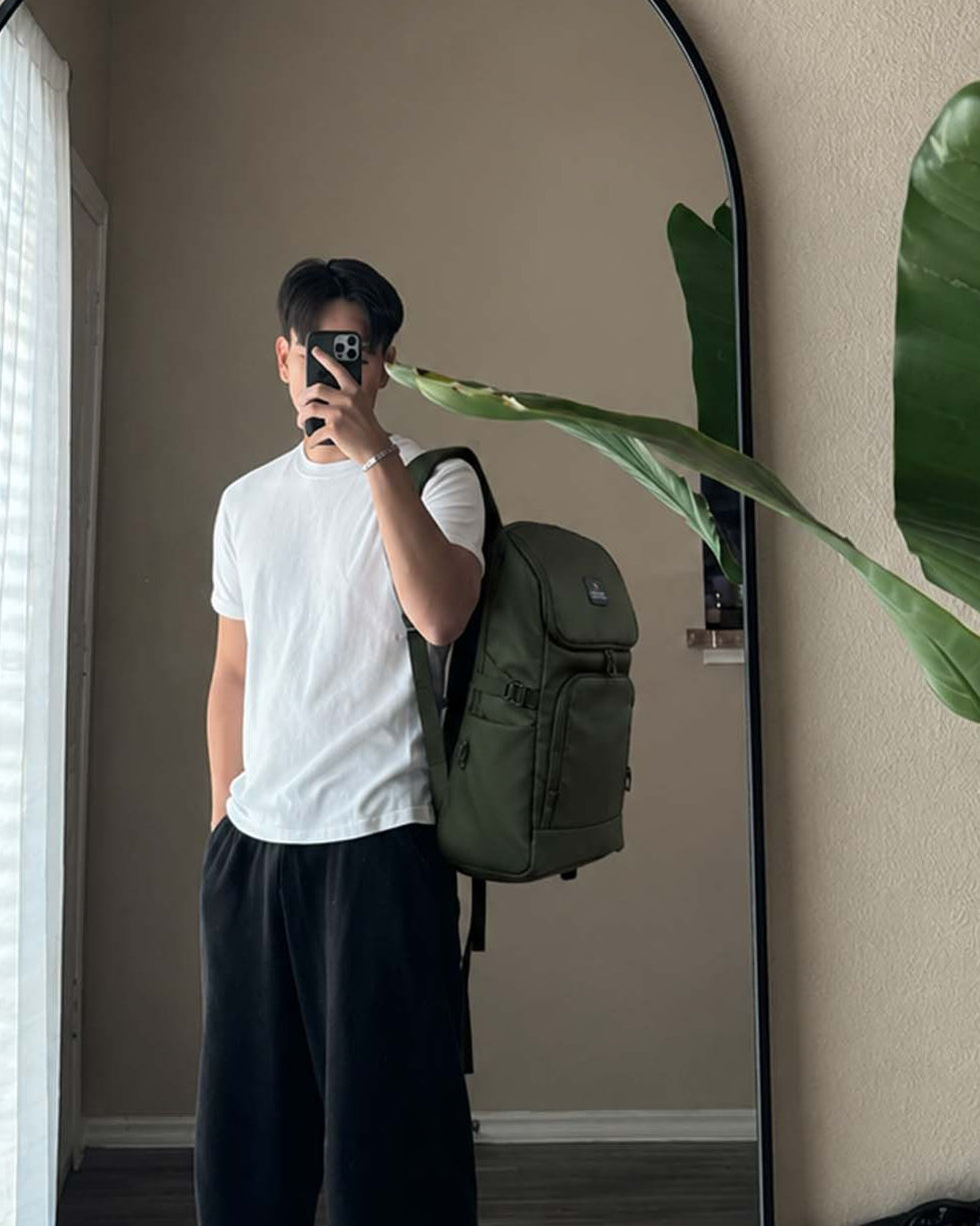 Man carrying OUTCLAZ MONSTER 30L laptop backpack